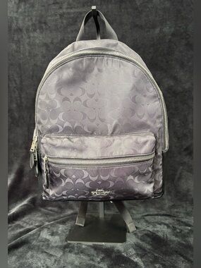 coach court backpack in blocked signature canvas in Chalk/Glacier Whit — Signature coated canvas and refined pebble leather Inside zip and multifunction pockets Double zip closure fabric lining Handle with 2 1/4 drop Outside zip pocket Adjustable shoulder straps 10 3/4 (L) x 12 1/2 (H) x 4 3/4 (W) Style No. NWT Coach Court Backpack In